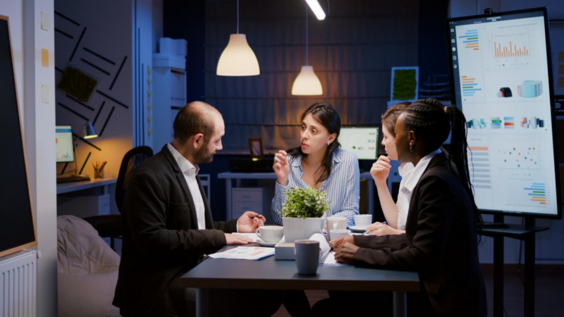 Investment professional reviewing detailed market analysis at desk